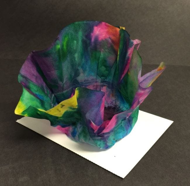 A sculpture is made from coffee filters and paint.