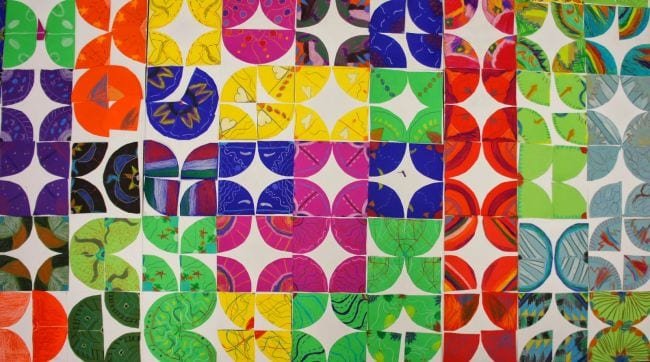 A colorful mosaic of squares is shown in this example of kindergarten art projects.