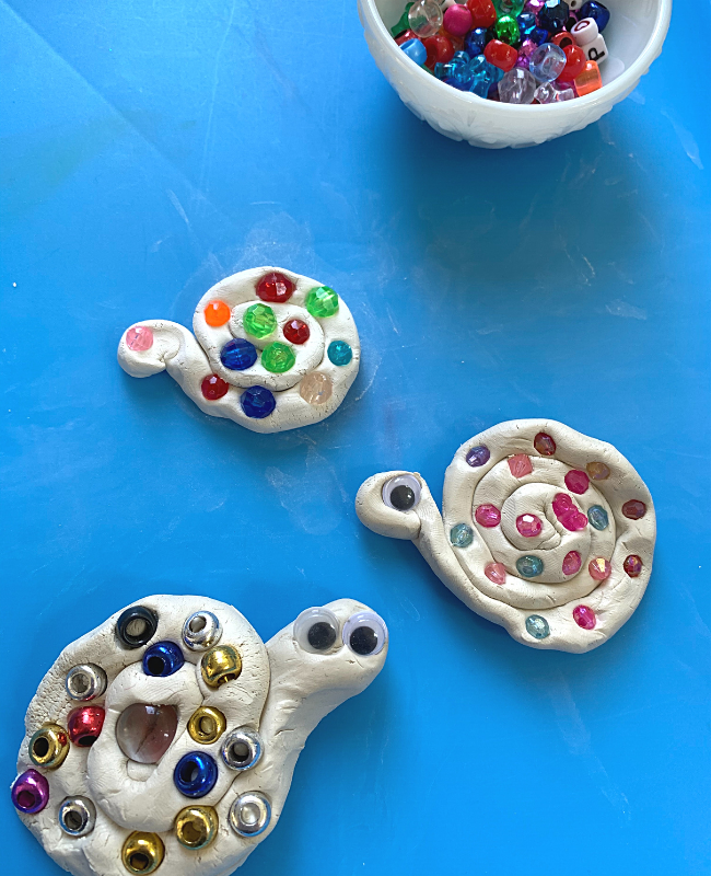 Simple snails made from coils and clay and accented with beads