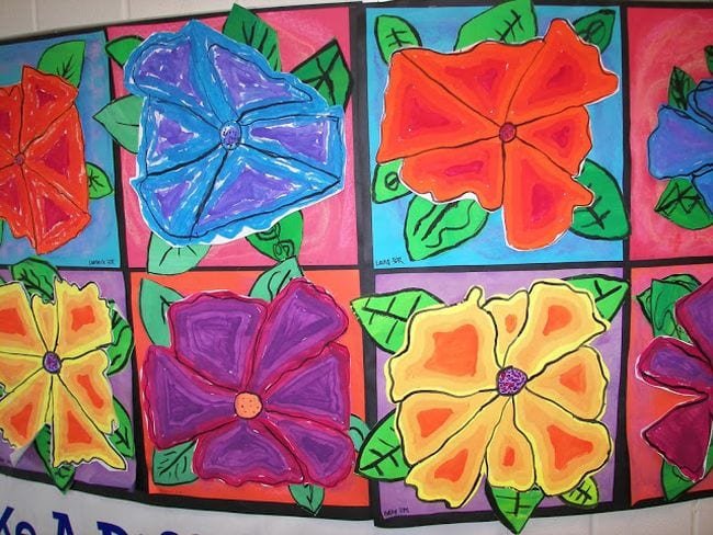 Large red, blue, yellow, and purple flowers in the style of Georgia O'Keefe (Third Grade Art)