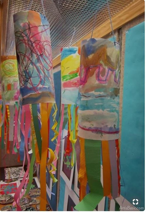 Colorful wind socks that have been made by children are shown.
