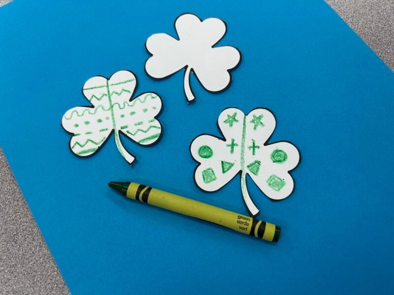 shamrock paper cutouts with symmetrical shapes on their petals