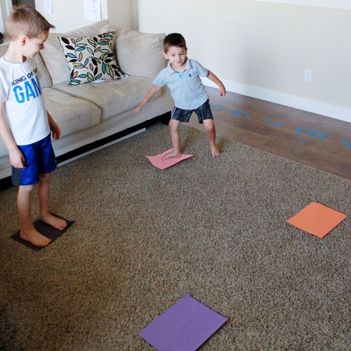 Four corners are designated by different colored papers. Students stand on different corners as an example of elementary PE games