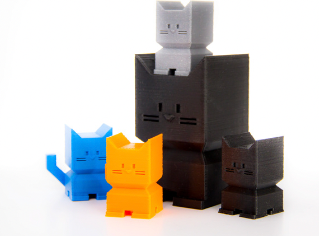 Different colored 3d printed cats as an example of 3D printing ideas