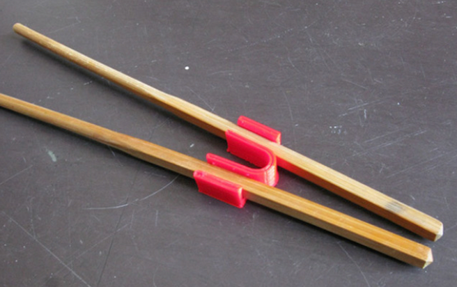 3d printed red chopstick trainer