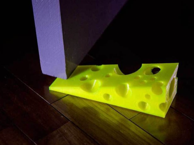 3d printed block of cheese wedged in door