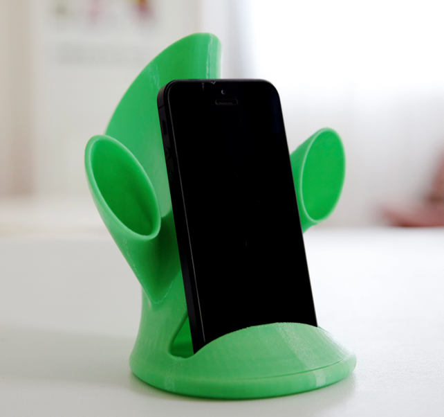 3d printed green sound amplifier on phone