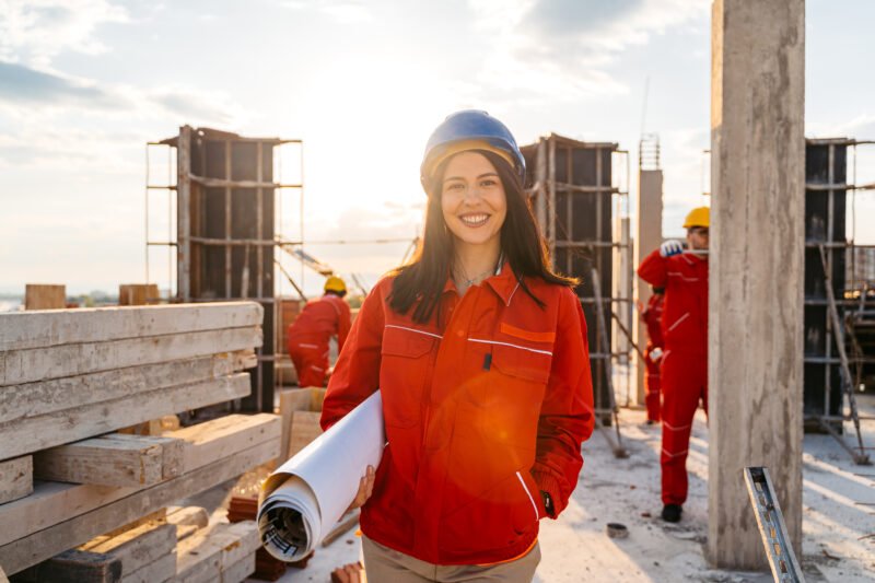 Portrait of a female architect on a construction site (building exterior)