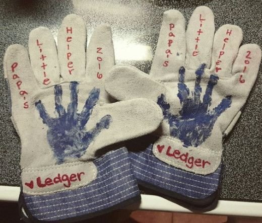Worker gloves with paint handprints on them