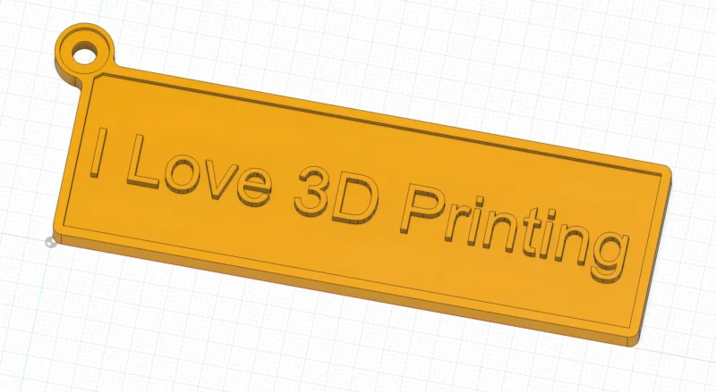 A yellow mockup of a keychain says I Love 3D Printing