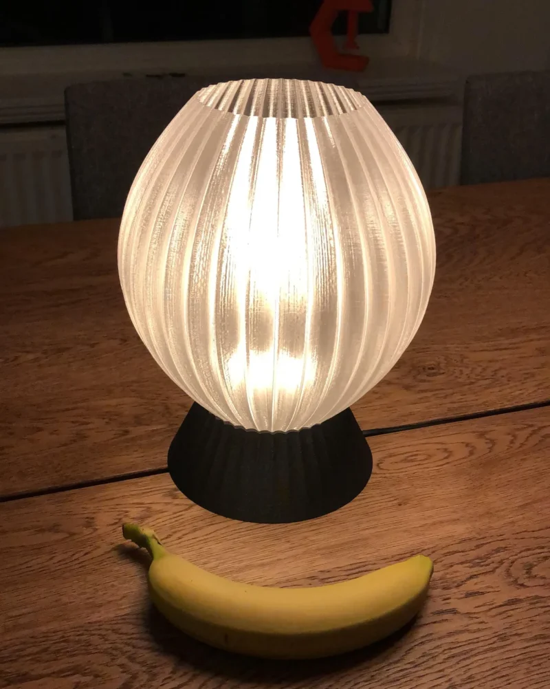 A small lamp is shown with a 3D printed white lampshade.