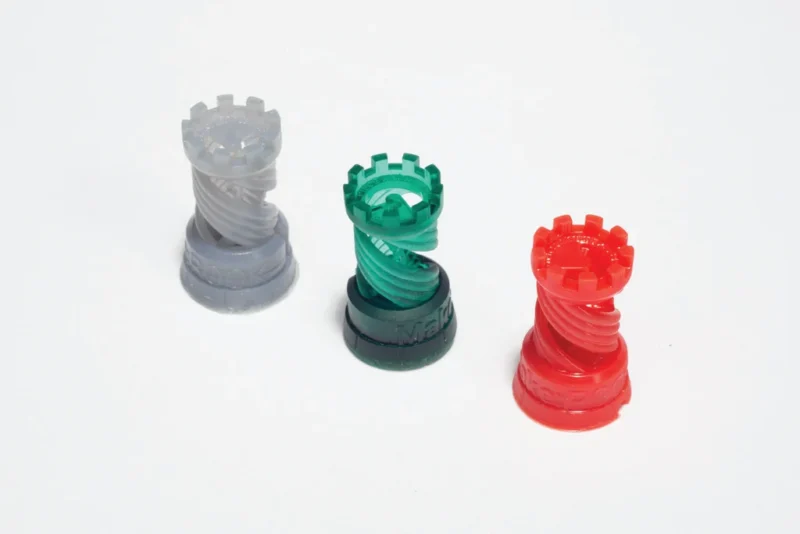 Three chess pieces are shown in clear, green, and red.