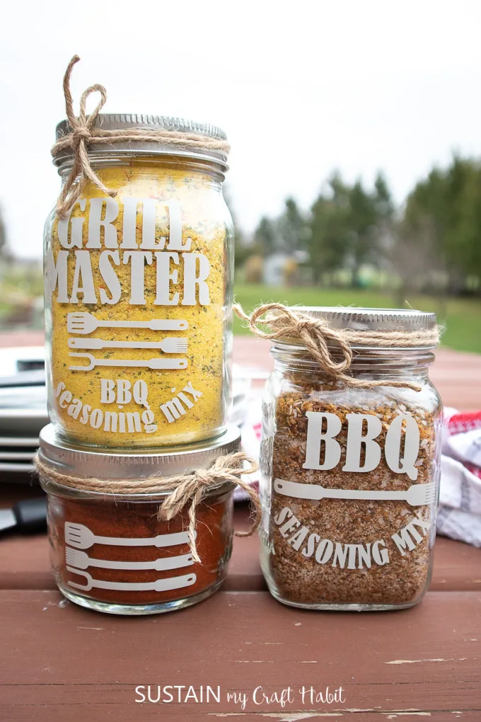 Three jars are shown filled with different seasonings as an example of Father's Day crafts for kids.