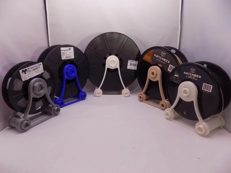 Several spools are shown on different plastic stands.