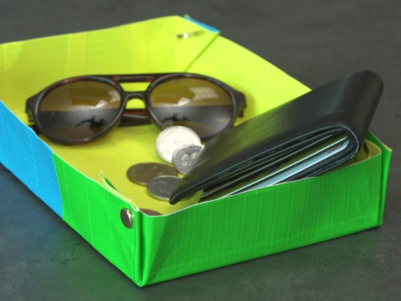 Neon colored tray made of duct tape holding wallet, keys, sunglasses as an example of father's day gifts for kids