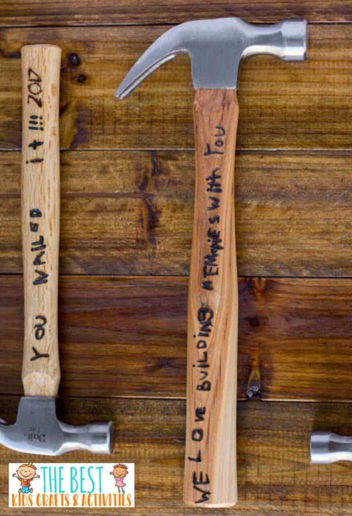 Two hammers with fathers day messages engraved in them.
