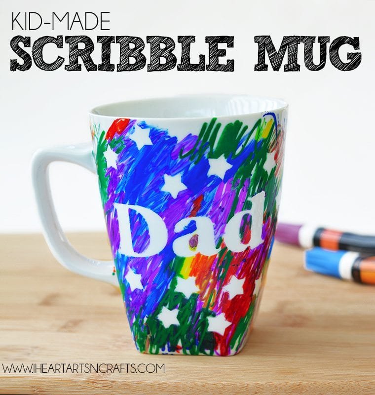A white mug says Dad and is colored brightly.