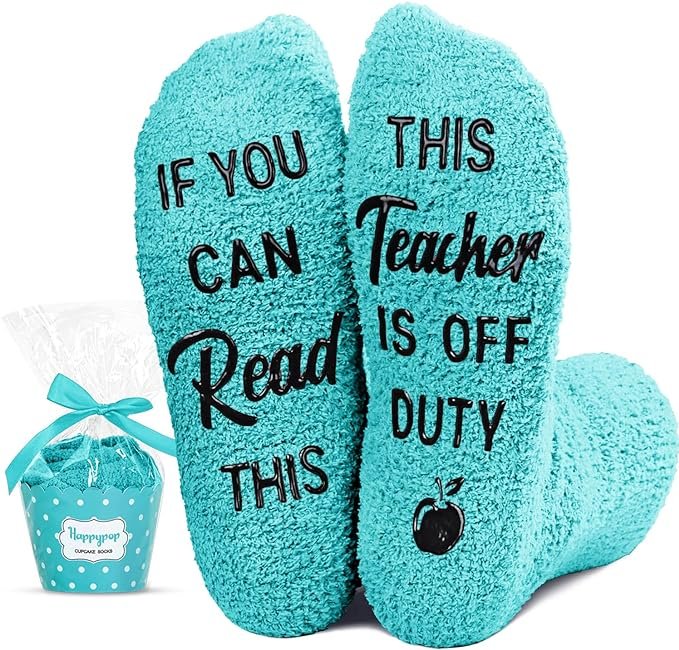 Light blue socks with soles saying 