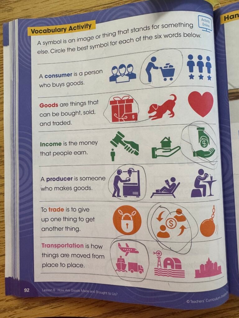 image of an elementary social studies curriculum workbook with pen circling correct answers