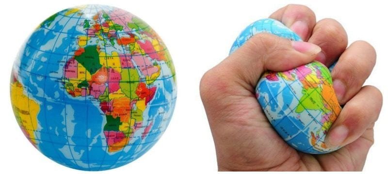 A rubber stress ball that looks like planet Earth and a hand squeezing one of them