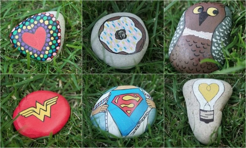 Colorfully decorated rocks lie in the grass as an example of inexpensive gift ideas for students