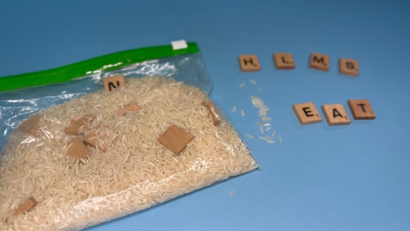 Bag of rice with beads of letters of alphabet in them
