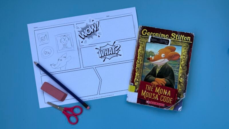 Comic strip drawn on piece of paper next to book