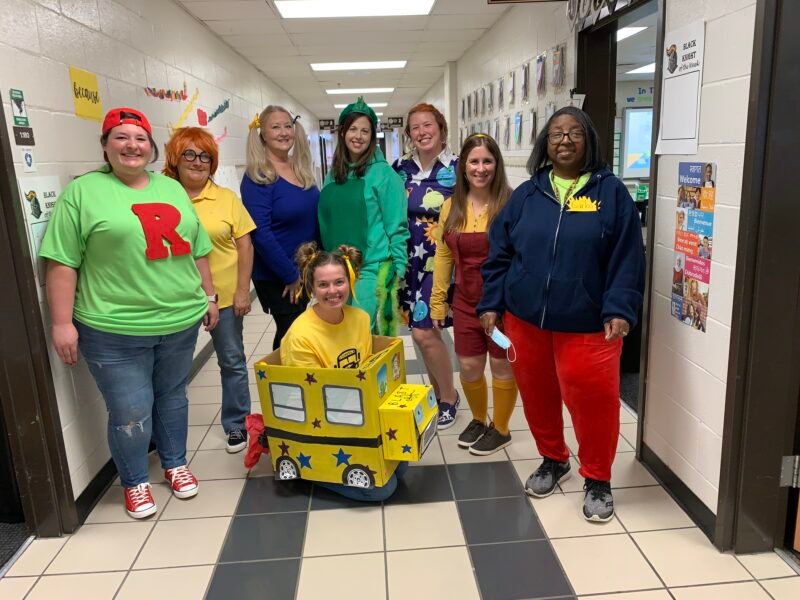 Teachers dressed as characters from The Magic Schoolbus