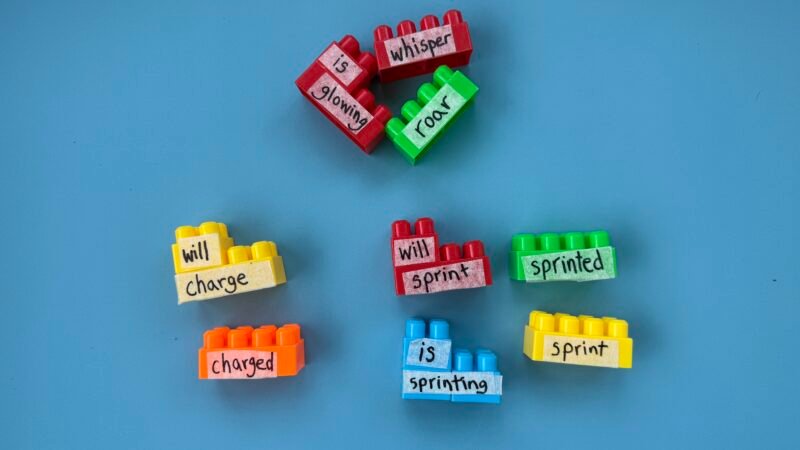 LEGO Verb Match with colorful legos with words written on them