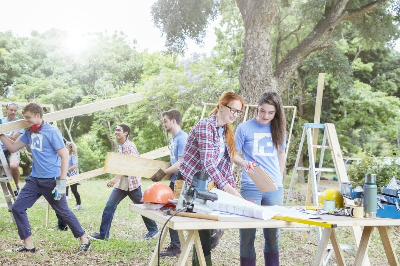 Students building a home with Habitat for Humanity for a service learning project