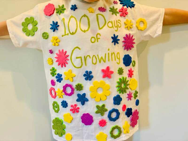 a student wearing a white shirt with the words 