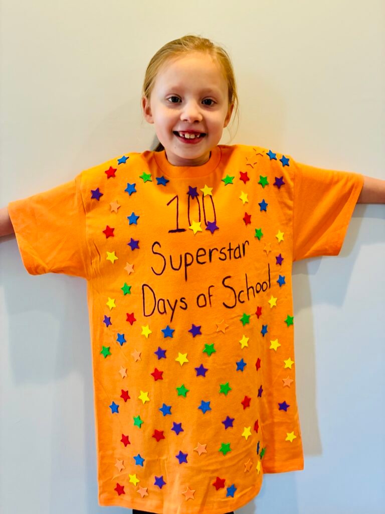 a student wearing a orange shirt with the words 