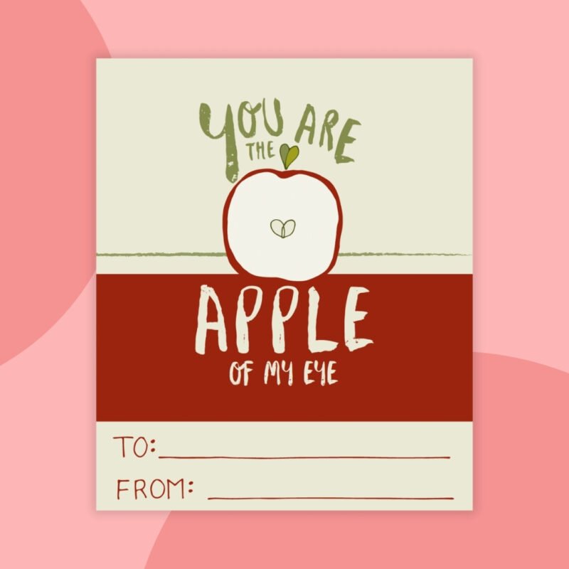 a printable valentine that says: you are the apple of my eye with a red and tan background and a red apple cut in half