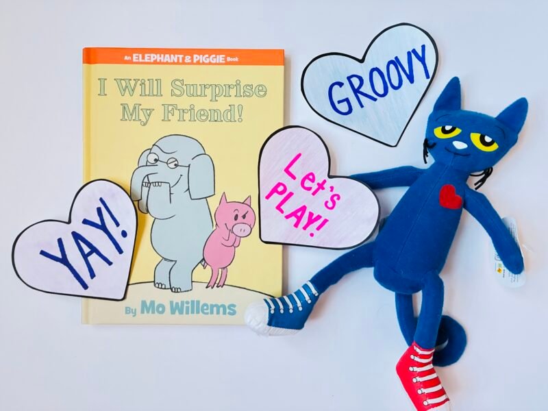 an image of three conversation hearts based on book characters: Gerald, Piggie and Pete the Cat