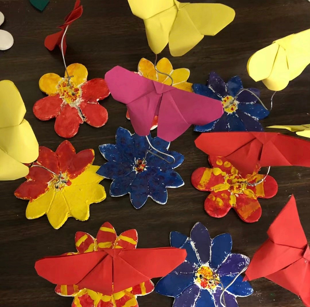 Origami butterflies on clay stands