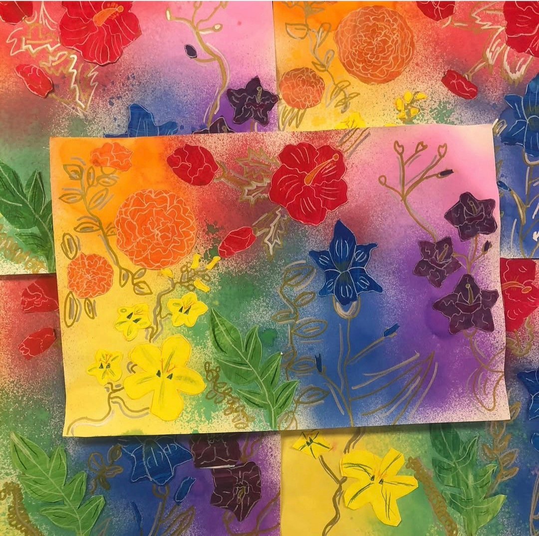 Holi-inspired flower paintings by first grade art students