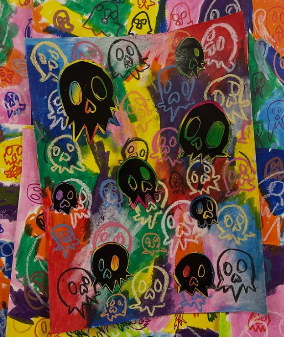 Colorful collage featuring skulls drawn with Sharpie and scratch art paper