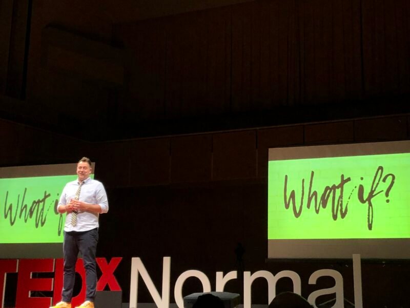 Adam Peterson TEDx Stage – What If? Adam Peterson TEDx Stage with the words What If on screen?