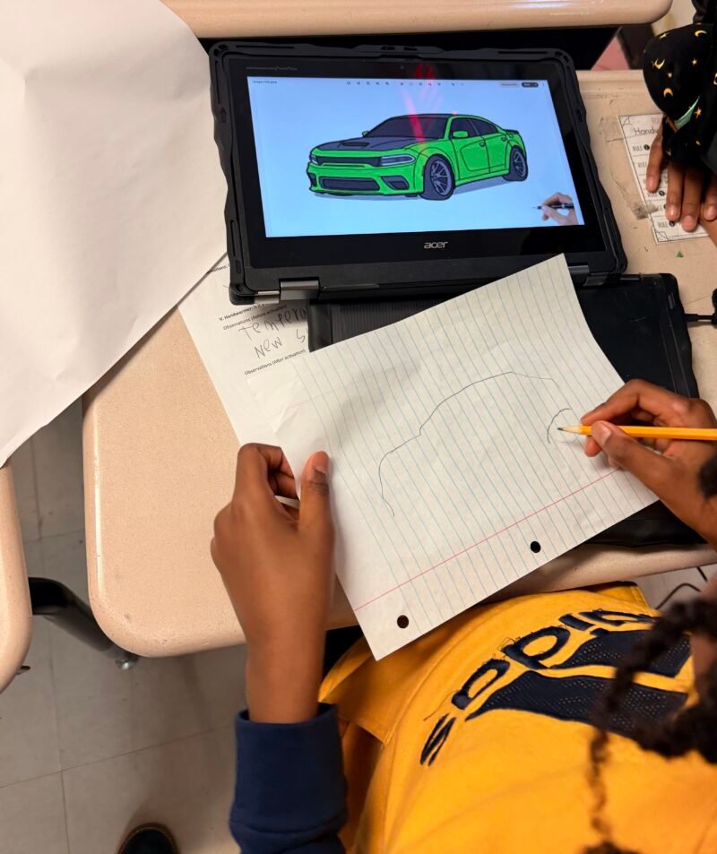 Students designing cars during a lesson as part of The Henry Ford inHub Model i curriculum. 