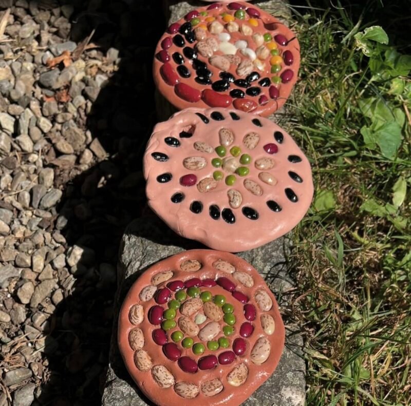 Mosaics made of dried beans pressed into clay