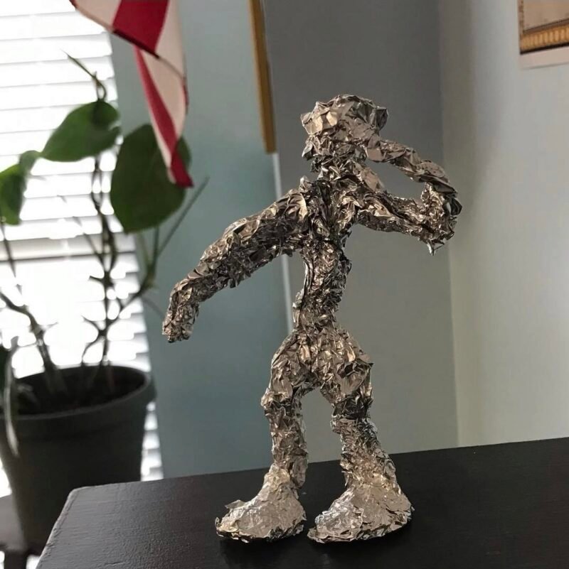 Sculpture of a human figure made from aluminum foil