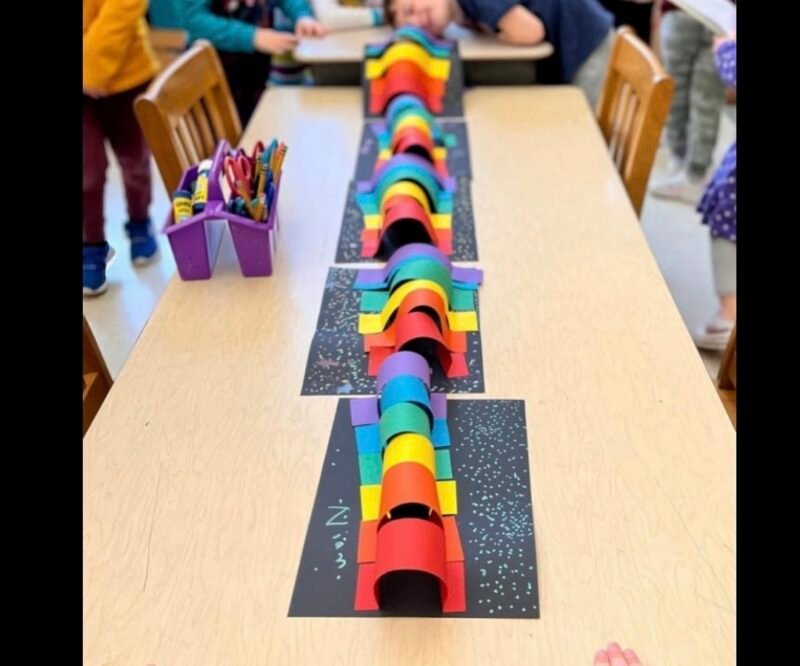Tunnels made of strips of colorful construction paper glued to black bases