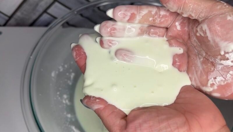 First Grade Science Projects Hands holding oobleck over a plate.