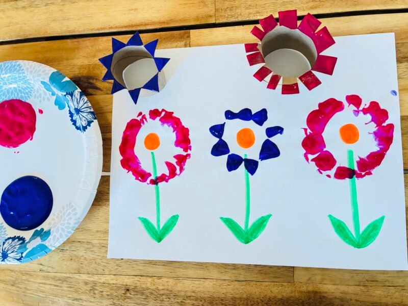 an earth day craft with flower paint stamps made out of paper rolls